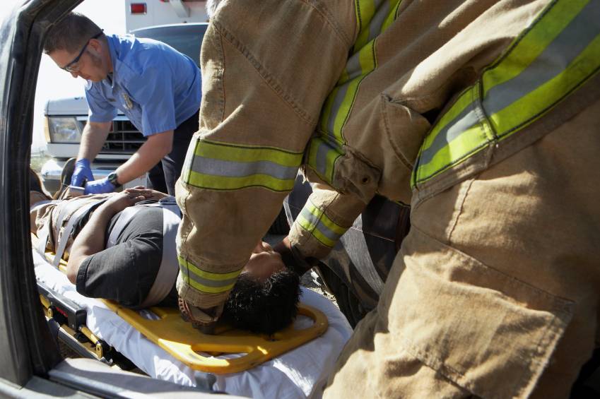 firefighter with car accident victim